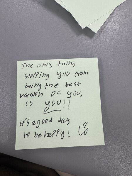 Handwritten sticky note with words of encouragement